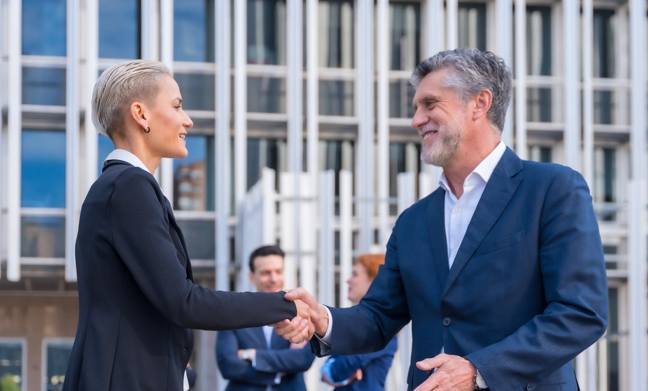 businessman shaking hands done deal